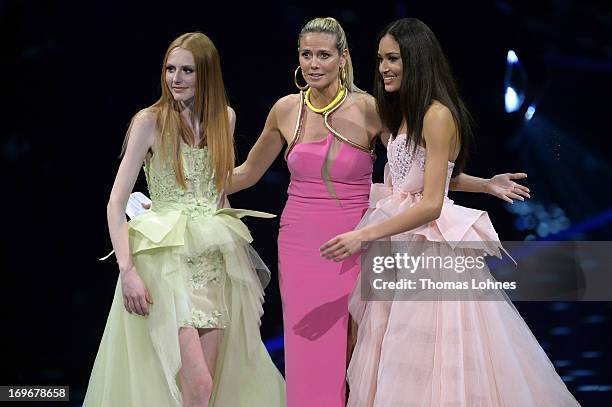 Presenter Heidi Klum , Lovelyn Enebechi and Maike van Grieken react during the final of 'Germany's Next Top Model by Heidi Klum ' TV show at SAP...