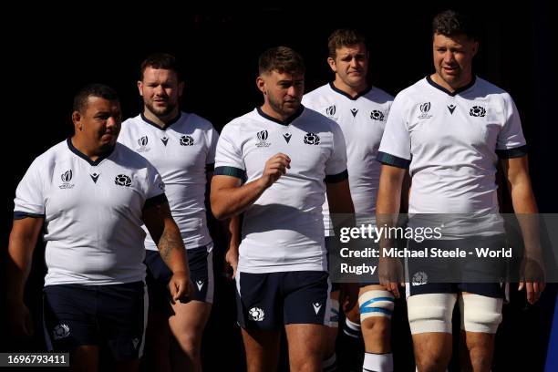 Javan Sebastian , Ollie Smith and Grant Gilchrist head out onto the playing area ahead of the Scotland Captain's Run ahead of the match between...