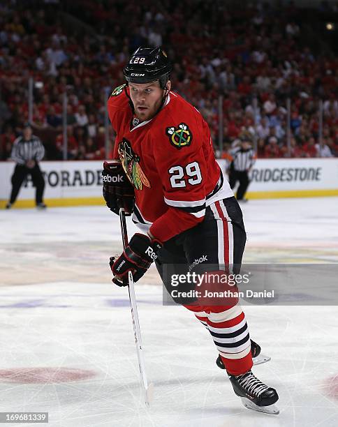 Bryan Bickell of the Chicago Blackhawks skates to the puck against the Detroit Red Wings in Game Seven of the Western Conference Semifinals during...