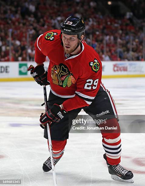 Bryan Bickell of the Chicago Blackhawks skates to the puck against the Detroit Red Wings in Game Seven of the Western Conference Semifinals during...