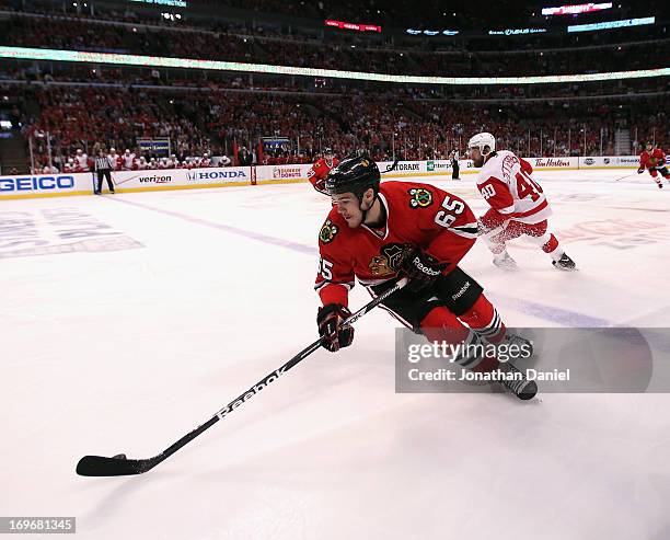 Andrew Shaw of the Chicago Blackhawks moves with the puck against the Detroit Red Wings in Game Seven of the Western Conference Semifinals during the...