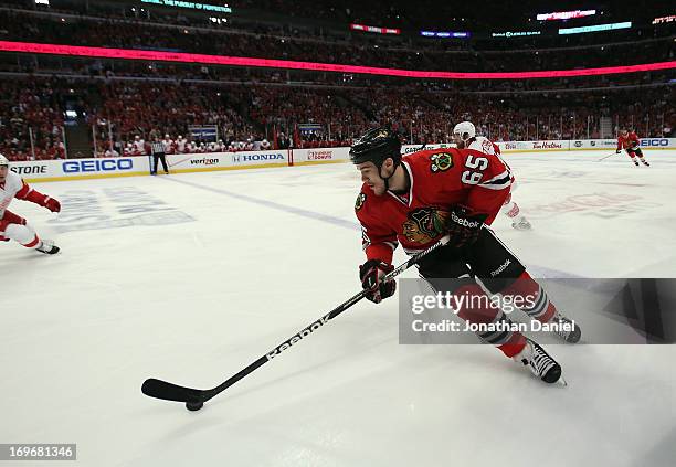 Andrew Shaw of the Chicago Blackhawks moves with the puck against the Detroit Red Wings in Game Seven of the Western Conference Semifinals during the...