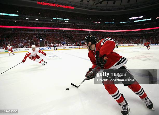 Andrew Shaw of the Chicago Blackhawks moves with the puck against the Detroit Red Wings in Game Seven of the Western Conference Semifinals during the...