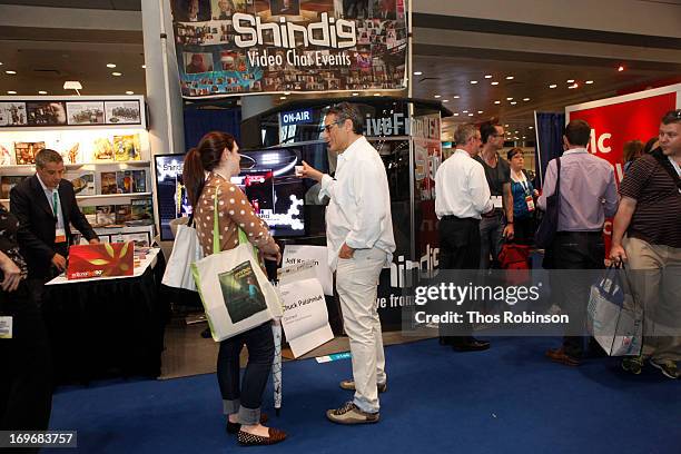 Steve Gottlieb, founder & CEO, Shindig speaks with guest at Shindig Hosts Live Video Chats with over Fifty Authors at BookExpo America 2013 at Jacob...