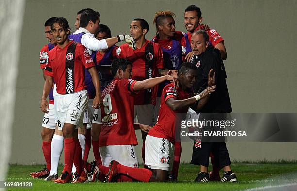 Mexico's Tijuana footballers celebrate after teammate Duvier Riascos scored against Brazil's Atletico Mineiro during their Libertadores Cup...