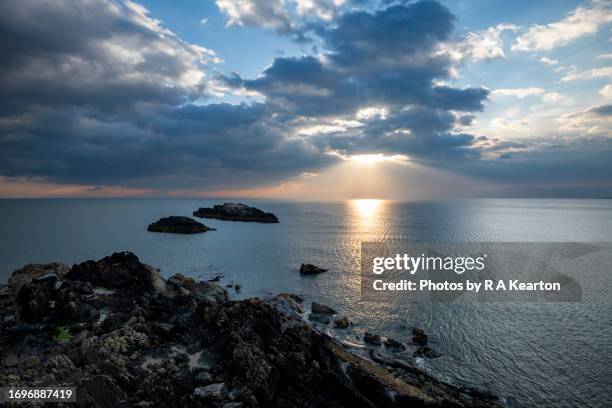 sunset at ynys llanddwyn, anglesey, north wales - headland stock pictures, royalty-free photos & images