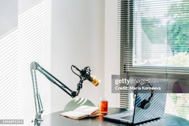 podcast studio with equipments. audio studio with laptop, microphone and headphones. - post production house stock pictures, royalty-free photos & images