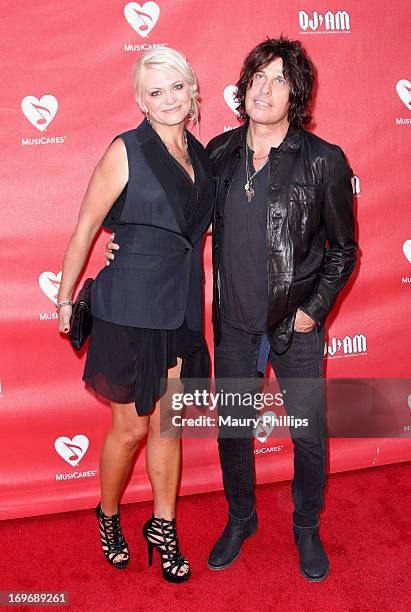 Guitarist Dean DeLeo of Stone Temple Pilots and Jenn DeLeo attend the 2013 MusiCares MAP Fund Benefit Concert honoring Chester Bennington and Tony...