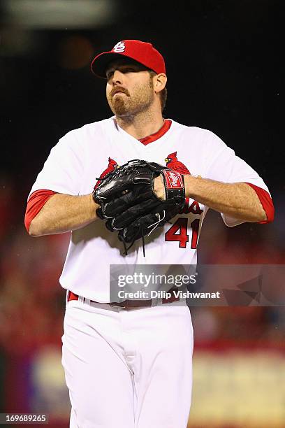 Reliever Mitchell Boggs of the St. Louis Cardinals reacts after giving up a game-tying solo home run to Jeff Francoeur of the Kansas City Royals in...