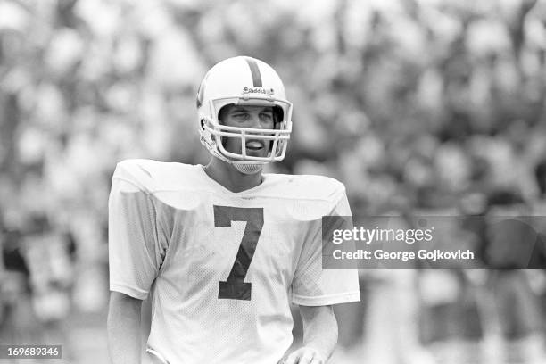 Quarterback John Elway of the Stanford University Cardinal looks on from the field during a college football game against the Purdue University...