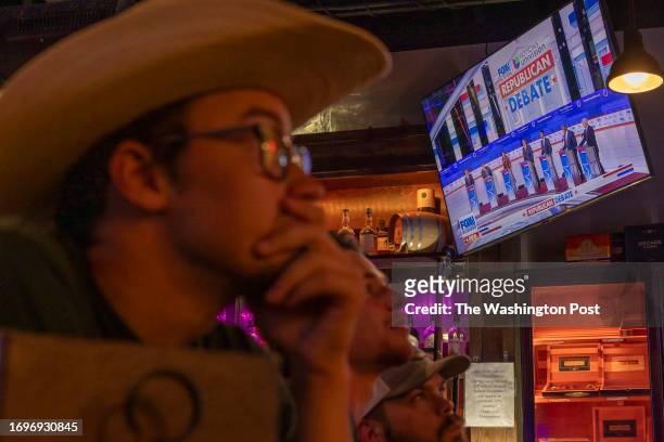 People gather to watch the second Republican presidential debate at The Whiskey House in Ankeny, Iowa, on Sept. 26, 2023.
