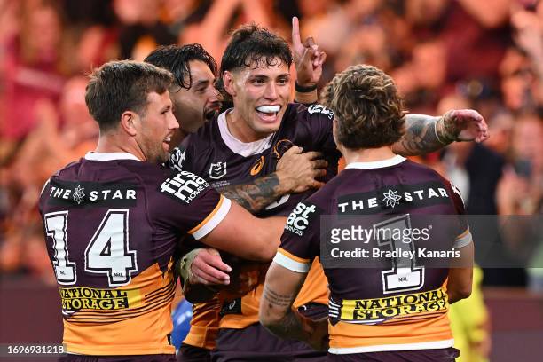 Jordan Riki of the Broncos celebrates with team mates after scoring a try during the NRL Preliminary Final match between Brisbane Broncos and New...