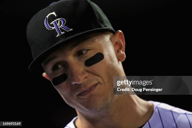 Shortstop Troy Tulowitzki of the Colorado Rockies looks on during a break in the action against the Houston Astros during Interleague play at Coors...