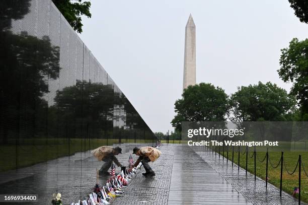 Man identifying himself as a Vietnam War veteran visits the Vietnam Veterans Memorial as people gather to observe Memorial Day on Monday May 29, 2023...