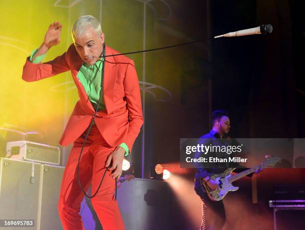 Neon Trees frontman Tyler Glenn swings a microphone around his neck as he and bassist Branden Campbell perform at the Couture Las Vegas jewelry show...