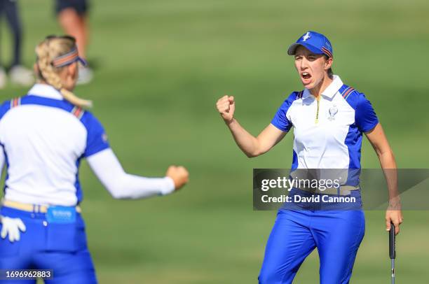 Carlotta Ciganda of The European Team roars her delight as her partner Emily Kristine Pedersen holes for a crucial birdie on the 14th green in their...