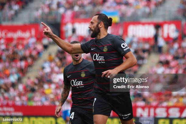 Vedat Muriqi of RCD Mallorca celebrates after scoring the team's first goal during the LaLiga EA Sports match between Girona FC and RCD Mallorca at...