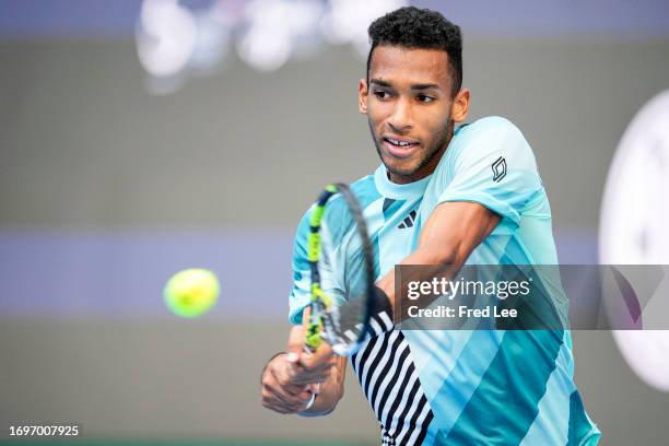 Felix Auger-Aliassime of Canada returns a shot against Holger Rune of Denmark during day 4 of the 2023 China Open at at National Tennis Center on...