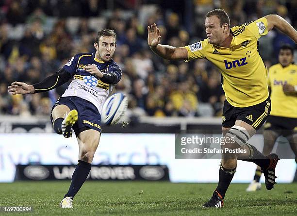 Nic White of the Brumbies kicks the ball during the round 16 Super Rugby match between the Brumbies and the Hurricanes at Canberra Stadium on May 31,...