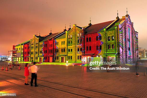 The work 'Digital Kakejiku' by digital artist Akira Hasegawa is projected to the wall of Yokohama Red Brick Wearhouse during the press preview on May...