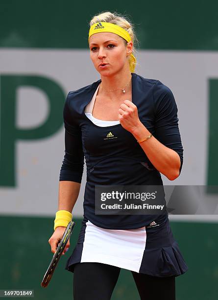 Maria Kirilenko of Russia celebrates a point during her Women's Singles match against Ashleigh Barty of Australia on day six of the French Open at...