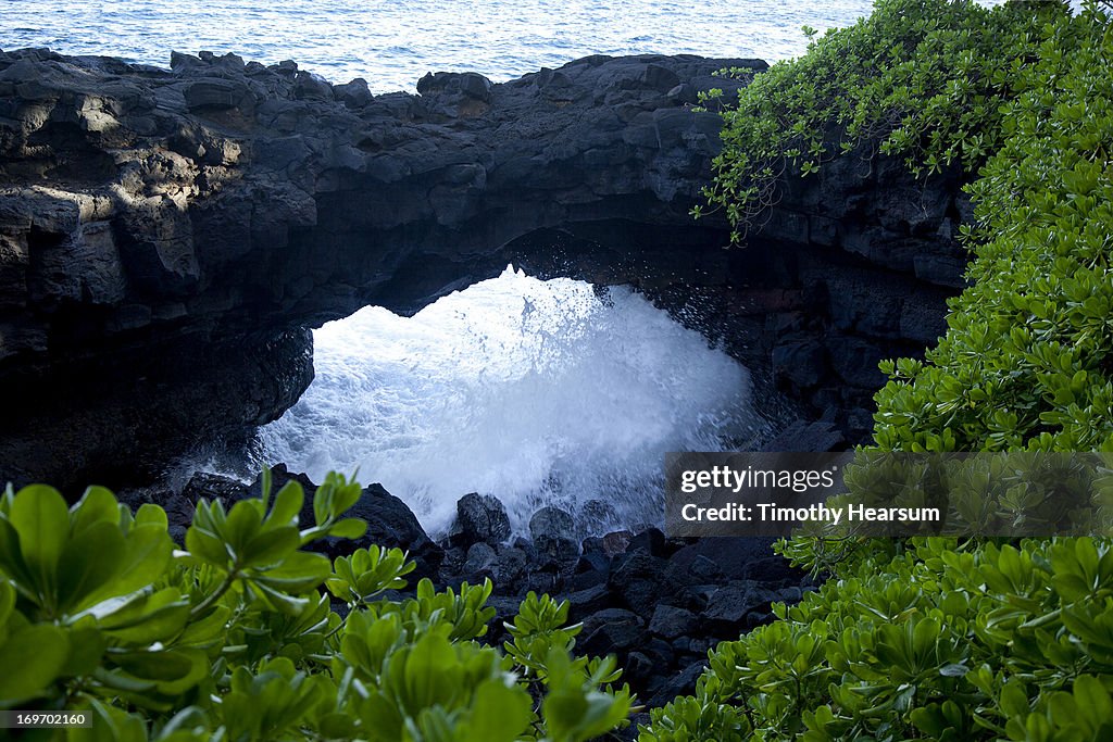 Surf splashes through collapsed lava tube