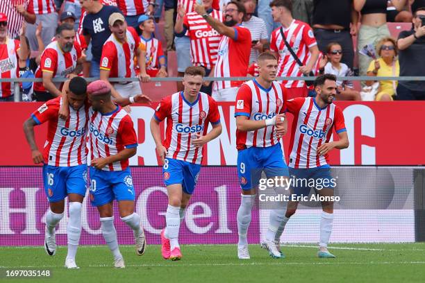 Artem Dovbyk of Girona celebrates with teammates after scoring the team's second goal during the LaLiga EA Sports match between Girona FC and RCD...