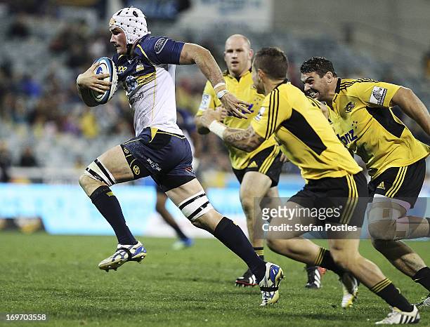 Ben Mowen of the Brumbies runs the ball during the round 16 Super Rugby match between the Brumbies and the Hurricanes at Canberra Stadium on May 31,...