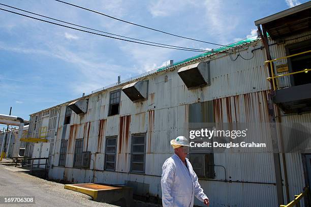 May 30: Charlie Saks walks past the 1941 slurry tube cooker processing plant that is used for purifying nitrocellulose. The primary mission of...