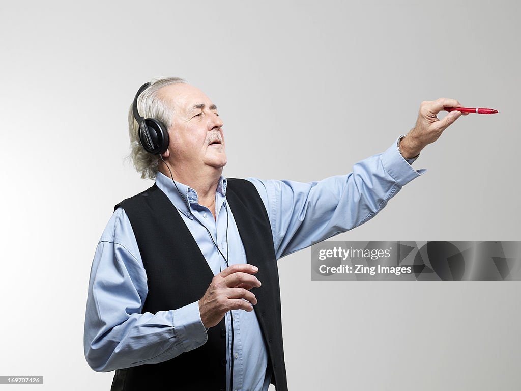 Senior man wearing headphones