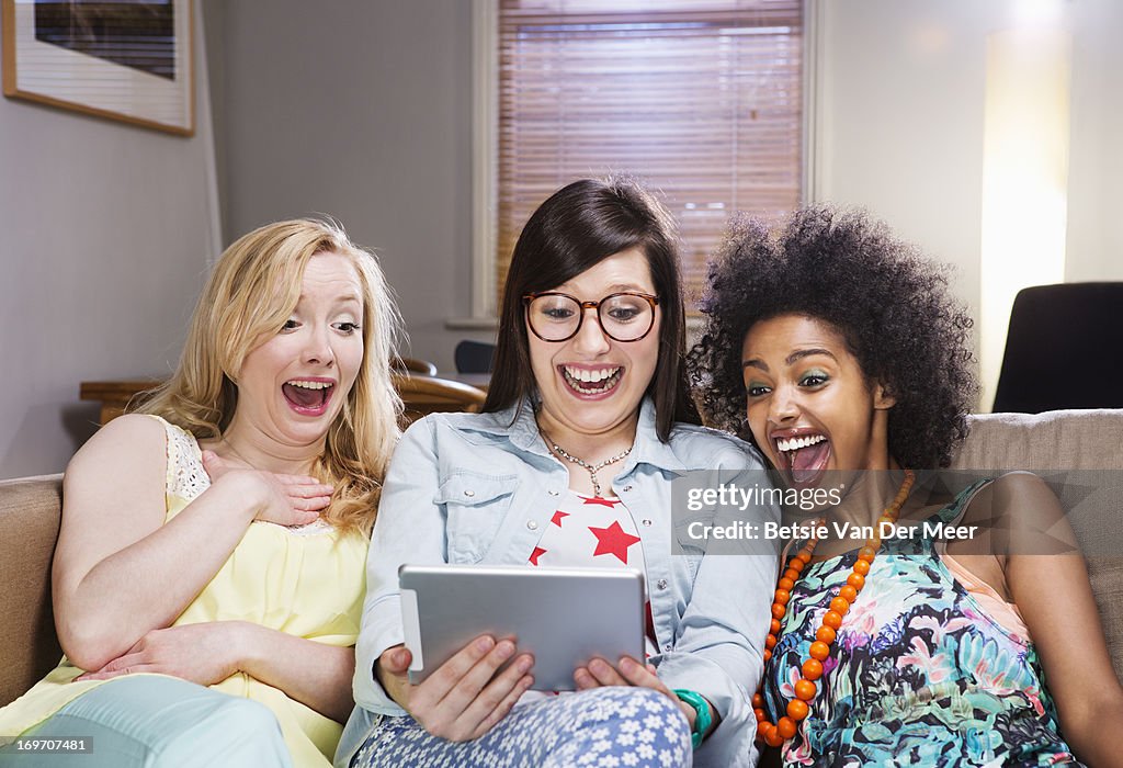 Women watching entertainment on digital tablet