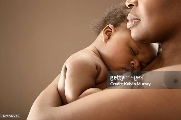 mums and babies - black baby stockfoto's en -beelden