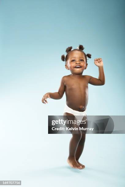 mums and babies - girl wearing diapers stock pictures, royalty-free photos & images