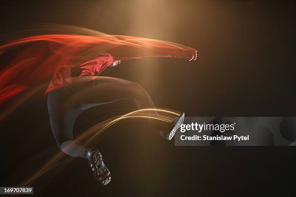 man jumping and leaving light streaks - long exposure light stock pictures, royalty-free photos & images