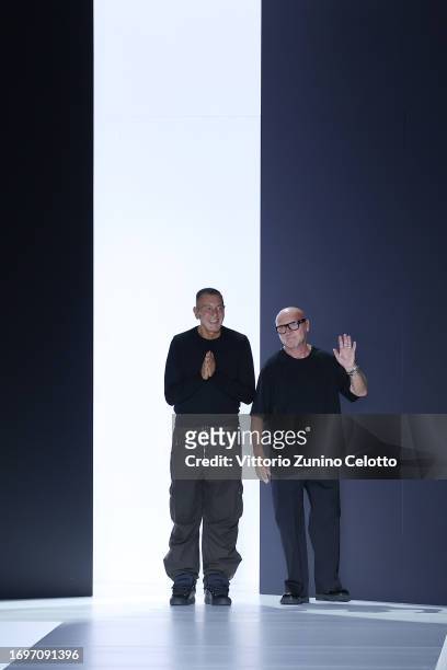 Designers Domenico Dolce and Stefano Gabbana acknowledges the applause of the audience at the runway at the Dolce&Gabbana fashion show during the...