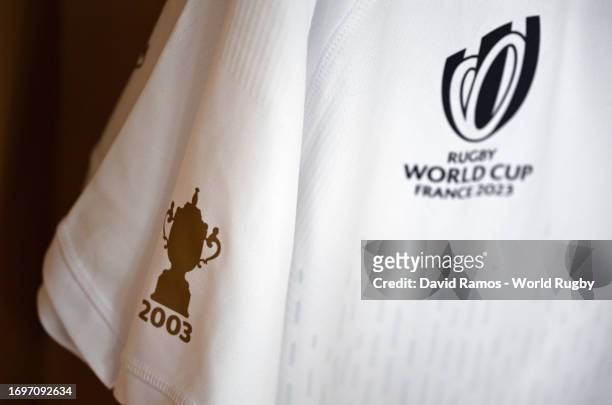 Detailed view of the The Webb Ellis Cup logo and "2003" inscription on the sleeve of a match shirt in the England changing room prior to the Rugby...