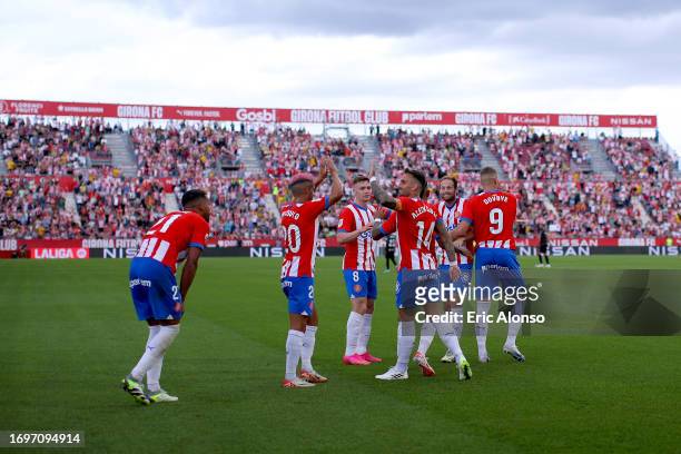 Girona players celebrate after Savio of Girona scores the team's fifth goal during the LaLiga EA Sports match between Girona FC and RCD Mallorca at...