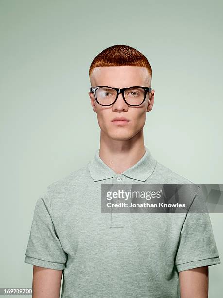 portrait of a red hair male with glasses on - geek stock pictures, royalty-free photos & images