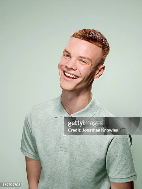 a portrait of a red hair male in pastel colours - portrait young adult caucasian isolated stockfoto's en -beelden