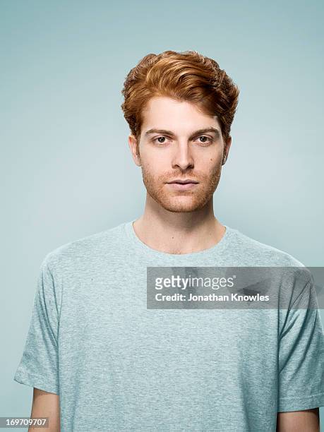 portrait of a re hair male looking into camera - hairstyle stock-fotos und bilder