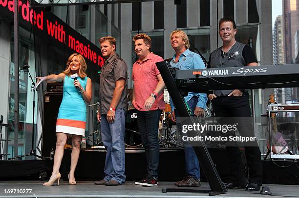 Alisyn Camerota interviews members of the band Lonestar during "FOX & Friends" All American Concert Series outside of FOX Studios on May 31, 2013 in...