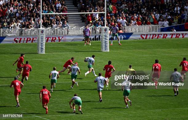 General view as Raffaele Storti of Portugal breaks free of the Georgia defence to score his team's second try during the Rugby World Cup France 2023...