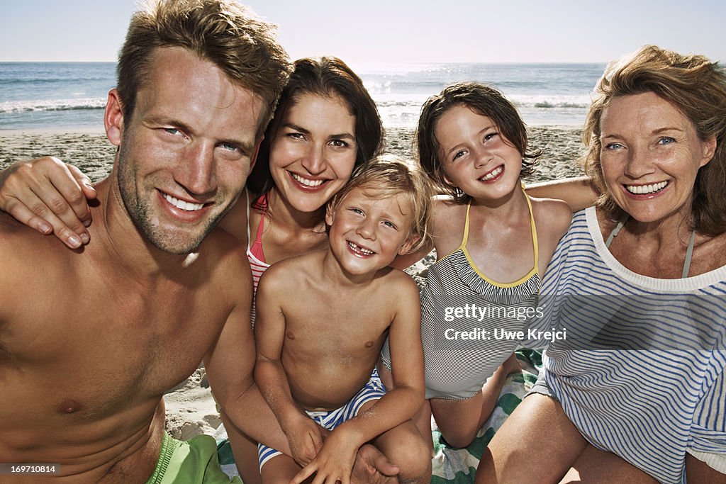 Portrait of family on beach, close up