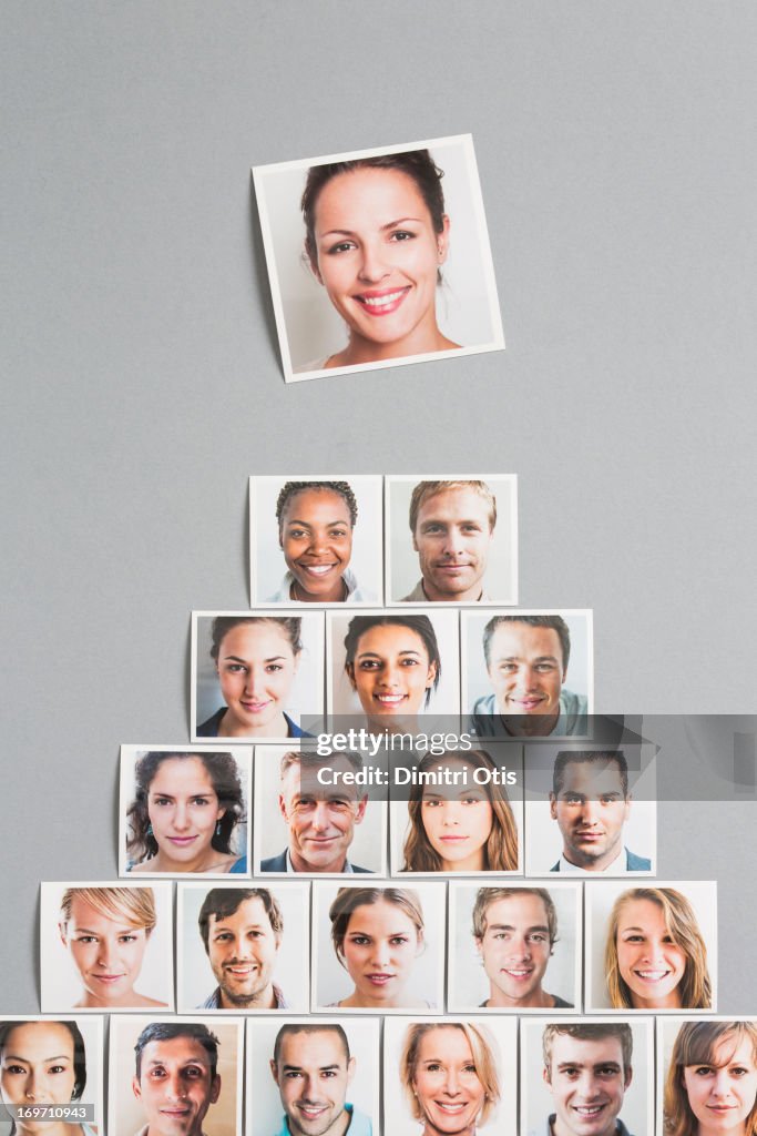 Pyramid of portrait prints, one of woman on top