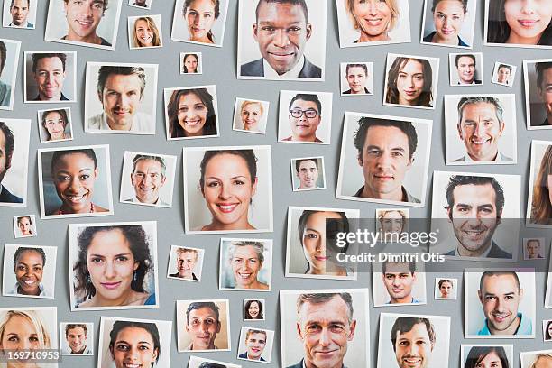 portrait prints arranged randomly - human face photos stock pictures, royalty-free photos & images