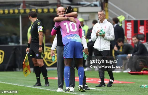 Rafael Leao of AC Milan celebrates with his coach Stefano Pioli after scoring the opening goal during the Serie A TIM match between AC Milan and...