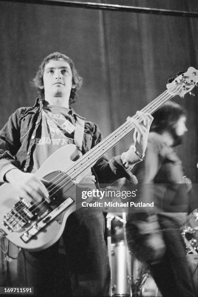 Bassist Steve Currie , of English glam rock group T-Rex, on stage during a soundcheck on the group's four-date British tour, June 1972.
