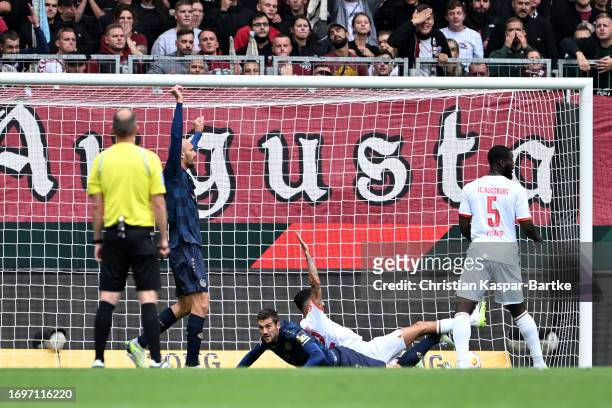 Stefan Bell of 1.FSV Mainz 05 scores the team's second goal that was later disallowed during the Bundesliga match between FC Augsburg and 1. FSV...