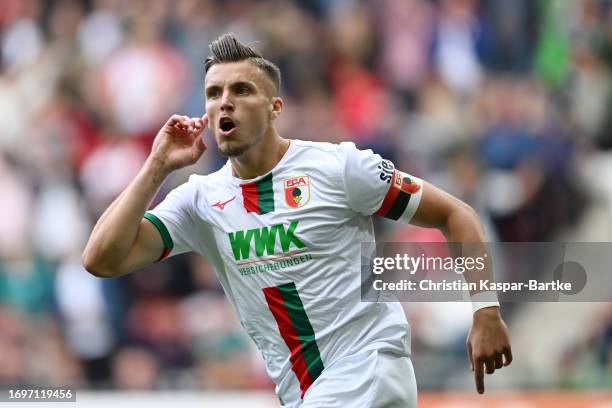 Ermedin Demirovic of FC Augsburg celebrates after scoring the team's first goal during the Bundesliga match between FC Augsburg and 1. FSV Mainz 05...
