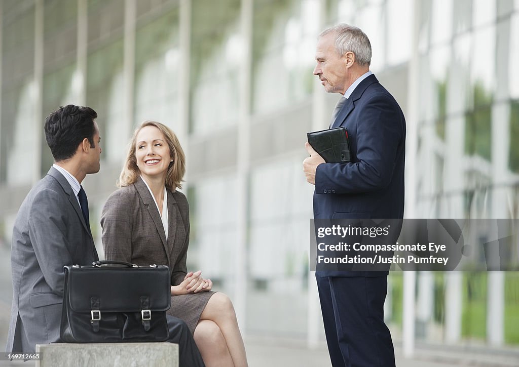 Business people relaxing outdoors